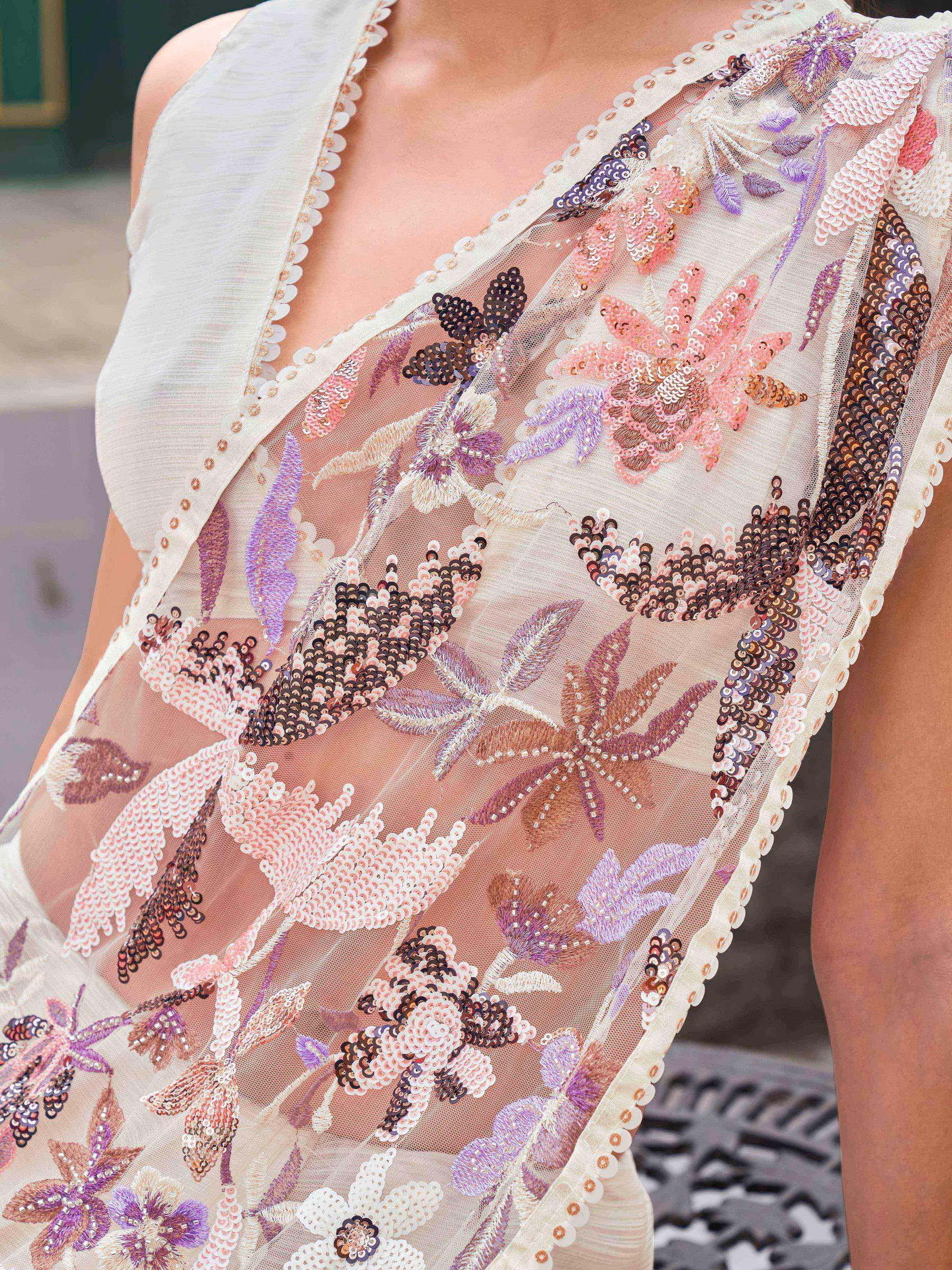 Cream colored designer saree with sequence and beads embroidery on shoulder portion